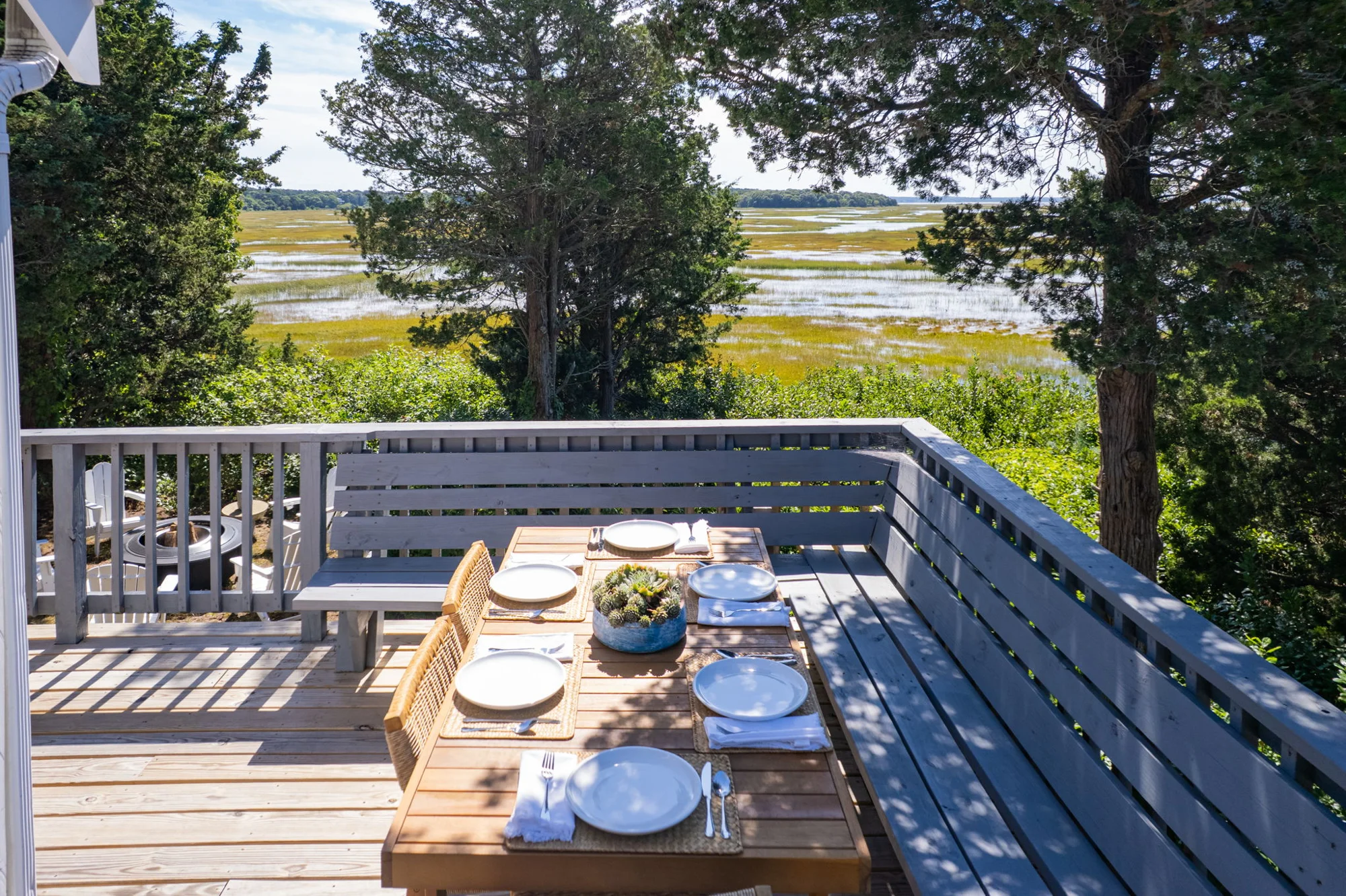 Outdoor dining table overlooking the tidal estuary